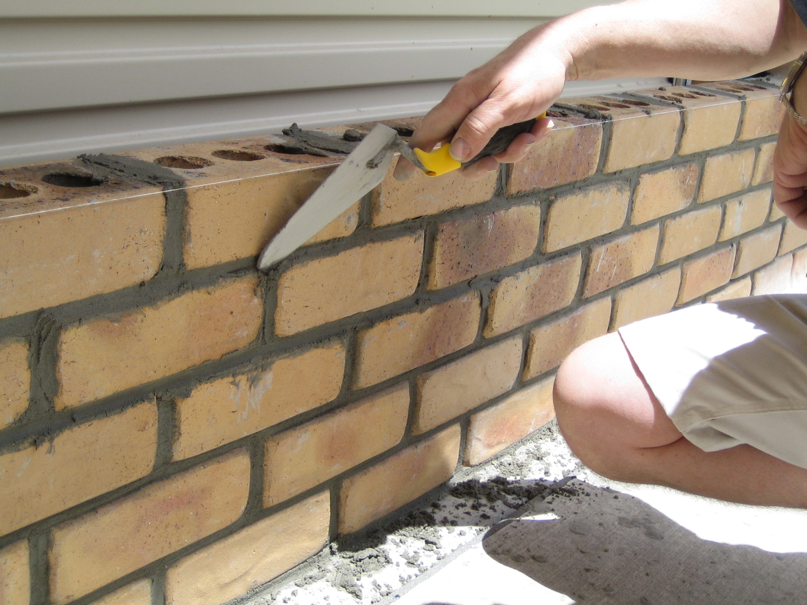 The bricklaying begins